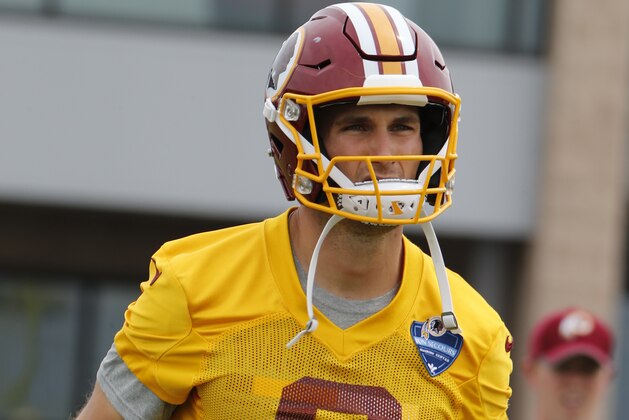 Washington Redskins quarterback Kirk Cousins (8) warms up during the first practice at the Washington Redskins NFL training camp in Richmond,. Va., Thursday, July 27, 2017. (AP Photo/Steve Helber)