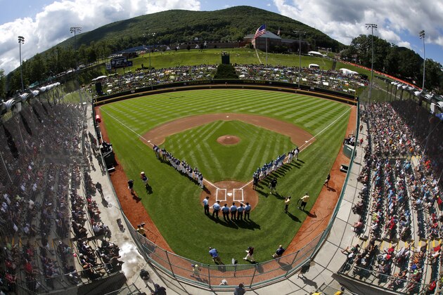 Portland, Ore., lines the first baseline and Pearland, Texas lines the third baseline during introductions before the first baseball game in United States pool play in Lamade Stadium at the Little League World Series tournament in South Williamsport, Pa., Friday, Aug. 21, 2015, AP Photo/Gene J. Puskar)