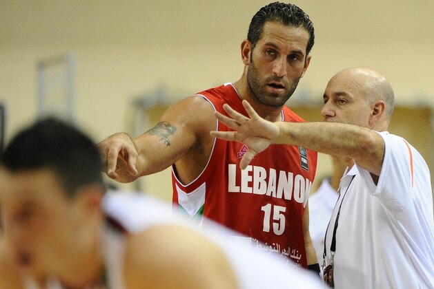 Lebanese coach Tab Baldwin (R) speaks wth Fadi El Khatib during the preliminary round game between Canada and Lebanon at the FIBA World Basketball Championships in Izmir, Turkey on August 28, 2010. AFP PHOTO / FRANCK FIFE (Photo credit should read FRANCK FIFE/AFP/Getty Images)