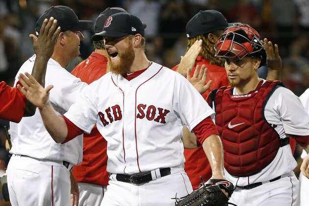 Boston Red Sox's Craig Kimbrel, left, and Christian Vazquez, right, celebrate after defeating the Chicago White Sox in a baseball game in Boston, Saturday, Aug. 5, 2017. (AP Photo/Michael Dwyer)