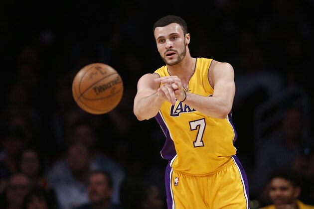 Los Angeles Lakers forward Larry Nance Jr. passes the ball against the Washington Wizards during the first half of an NBA basketball game, Tuesday, March 28, 2017, in Los Angeles. (AP Photo/Danny Moloshok)