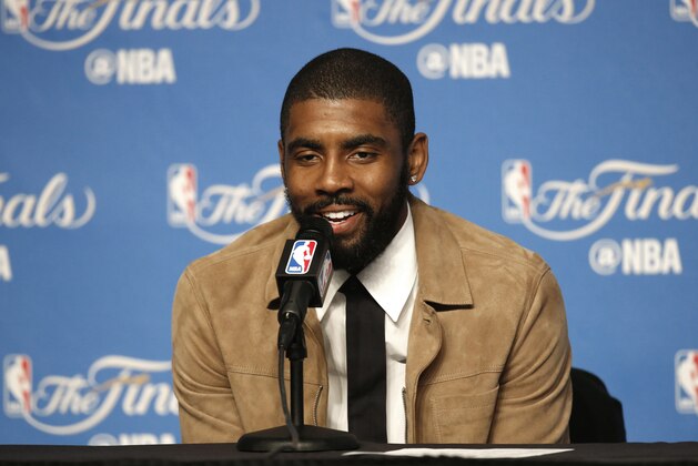 Cleveland Cavaliers' Kyrie Irving speaks to reporters early Saturday, June 10, 2017, in Cleveland after the Cavaliers defeated the Golden State Warriors 137-116 in Game 4 of basketball's NBA Finals. (AP Photo/Ron Schwane)