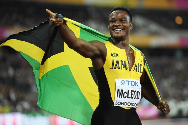 LONDON, ENGLAND - AUGUST 07:  Omar McLeod of Jamaica celebrates with the Jamaican flag after winning the Men's 110 metres hurdles final during day four of the 16th IAAF World Athletics Championships London 2017 at The London Stadium on August 7, 2017 in London, United Kingdom.  (Photo by Matthias Hangst/Getty Images)