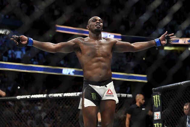 ANAHEIM, CA - JULY 29:  Jon Jones celebrates after defeating Daniel Cormier in their UFC light heavyweight championship bout during the UFC 214 event inside the Honda Center on July 29, 2017 in Anaheim, California. (Photo by Jeff Bottari/Zuffa LLC/Zuffa LLC via Getty Images)