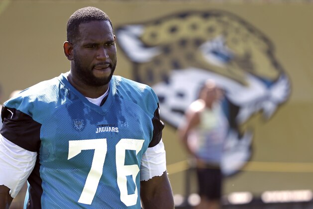 Jacksonville Jaguars offensive lineman Branden Albert (76) arrives at practice during NFL football training camp, Friday, July 28, 2017, in Jacksonville, Fla. (AP Photo/John Raoux)