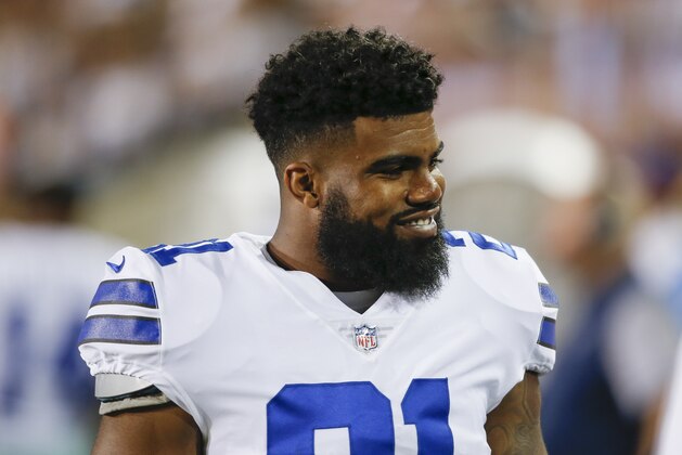 Dallas Cowboys running back Ezekiel Elliott (21) smiles on the sideling during the first half of the Pro Football Hall of Fame NFL preseason game against the Arizona Cardinals in Canton, Ohio, Thursday, Aug. 3, 2017. (AP Photo/Ron Schwane)