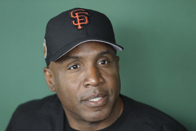 FILE - This March 22, 2017 file photo shows Barry Bonds responding to a question during a news conference in Scottsdale, Ariz. Bonds so badly wanted to play one final season in 2008 and believes he would have hit 800 home runs or come very close. It “stung” to walk away from a decorated 22-year career with little notice immediately after a record-setting season in which he became home run king with the San Francisco Giants. Bonds is over all that now, working for the Giants, and he was back at AT&T Park, Monday, Aug. 7, 2017, on the 10-year anniversary of his 756th home run here that broke Hank Aaron’s record in2007. (AP Photo/Darron Cummings, file)