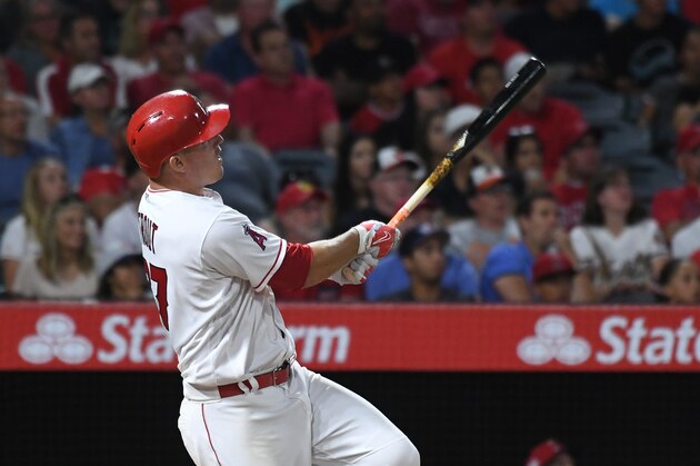Aug 7, 2017; Anaheim, CA, USA; Los Angeles Angels center fielder Mike Trout (27) hits a solo home run against the Baltimore Orioles in the sixth inning at Angel Stadium of Anaheim. Mandatory Credit: Richard Mackson-USA TODAY Sports