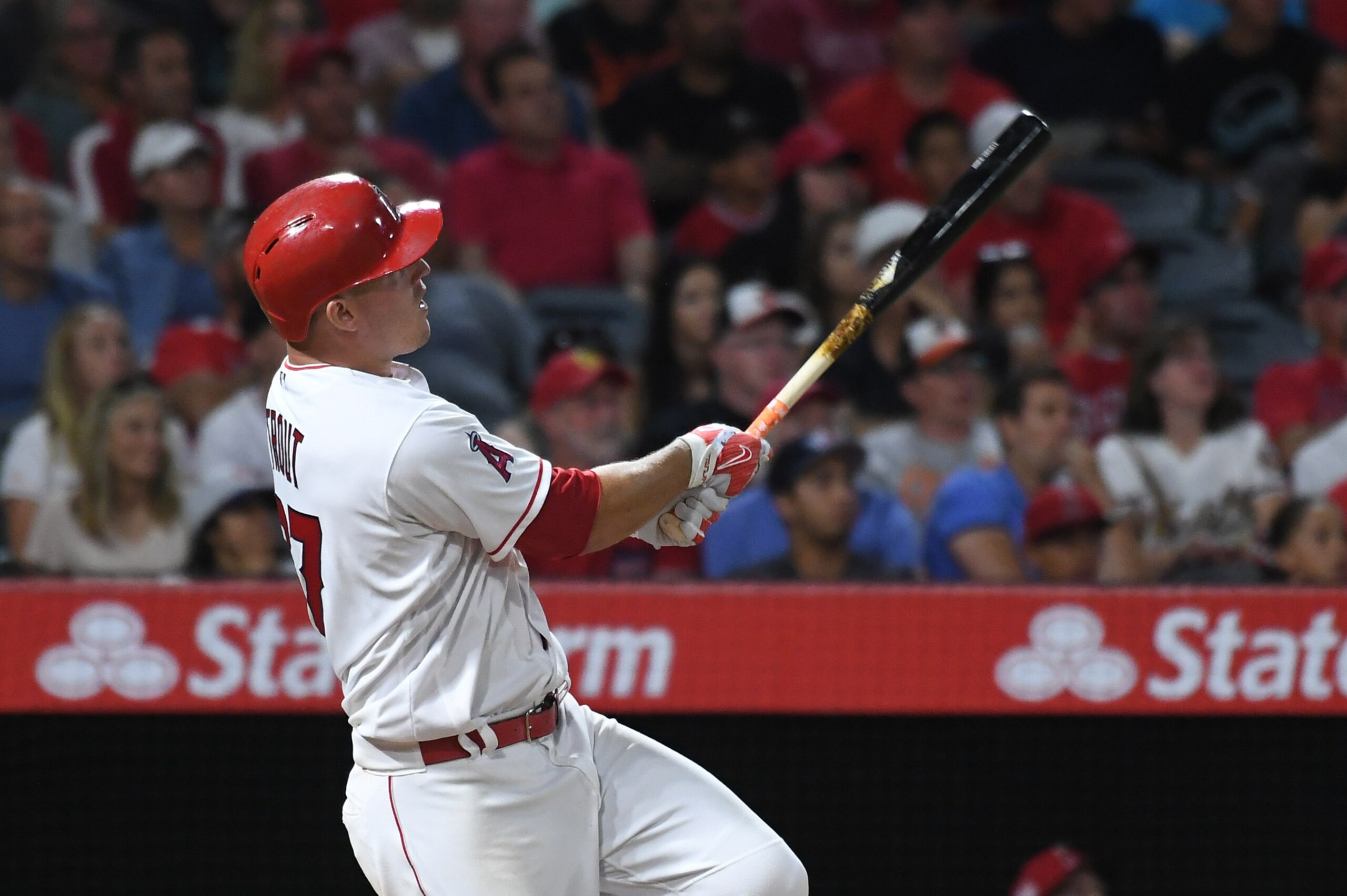 Aug 7, 2017; Anaheim, CA, USA; Los Angeles Angels center fielder Mike Trout (27) hits a solo home run against the Baltimore Orioles in the sixth inning at Angel Stadium of Anaheim. Mandatory Credit: Richard Mackson-USA TODAY Sports