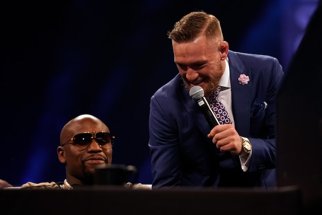 LONDON, ENGLAND - JULY 14:  (R-L) Conor McGregor taunts Floyd Mayweather Jr. during the Floyd Mayweather Jr. v Conor McGregor World Press Tour event at SSE Arena on July 14, 2017 in London, England. (Photo by Jeff Bottari/Zuffa LLC/Zuffa LLC via Getty Images)