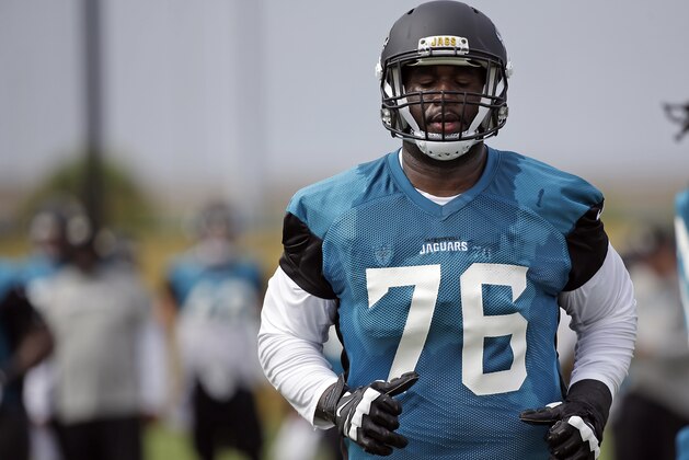 Jacksonville Jaguars offensive lineman Branden Albert warms up during NFL football training camp, Thursday, July 27, 2017, in Jacksonville, Fla. (AP Photo/John Raoux)