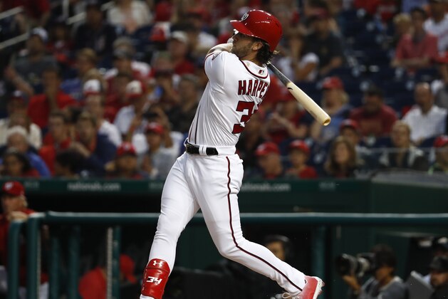 Washington Nationals' Bryce Harper watches his single home run during the fourth inning of a baseball game against the Miami Marlins, Monday, Aug. 7, 2017, in Washington. (AP Photo/Carolyn Kaster)