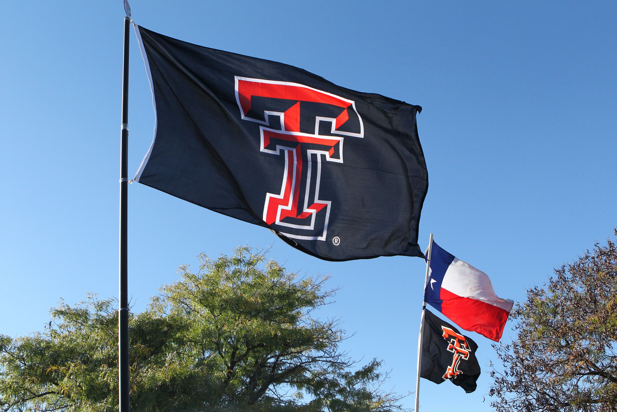 Oct 22, 2016; Lubbock, TX, USA;  Texas Tech Red Raiders flags fly outside Jones AT&T Stadium before the game with the Oklahoma Sooners. Mandatory Credit: Michael C. Johnson-USA TODAY Sports