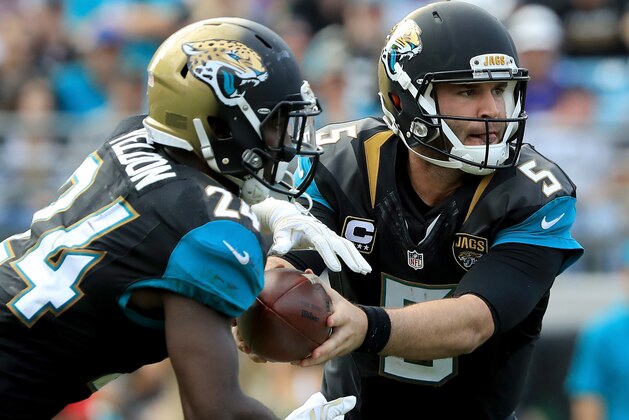 JACKSONVILLE, FL - DECEMBER 11:   T.J. Yeldon #24 of the Jacksonville Jaguars takes the handoff from Blake Bortles #5 during the game against the Minnesota Vikings at EverBank Field on December 11, 2016 in Jacksonville, Florida.  (Photo by Sam Greenwood/Getty Images)