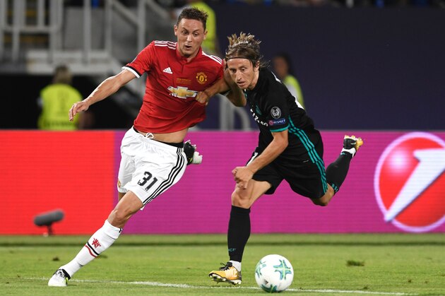 Manchester United's Serbian midfielder Nemanja Matic (L) vies with Real Madrid's Croatian midfielder Luka Modric during the UEFA Super Cup football match between Real Madrid and Manchester United on August 8, 2017, at the Philip II Arena in Skopje. / AFP PHOTO / Nikolay DOYCHINOV        (Photo credit should read NIKOLAY DOYCHINOV/AFP/Getty Images)