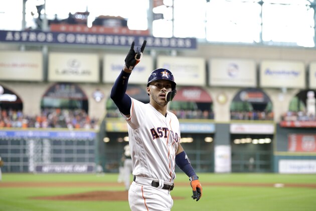 Houston Astros' Carlos Correa celebrates after hitting a two-run home run against the Oakland Athletics during the sixth inning of a baseball game Thursday, June 29, 2017, in Houston. (AP Photo/David J. Phillip)