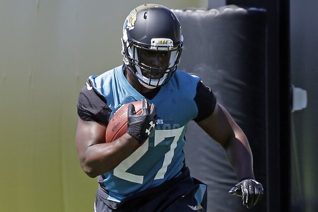 Jacksonville Jaguars running back Leonard Fournette runs through obstacles during NFL football practice, Thursday, May 25, 2017, in Jacksonville, Fla. (AP Photo/John Raoux)
