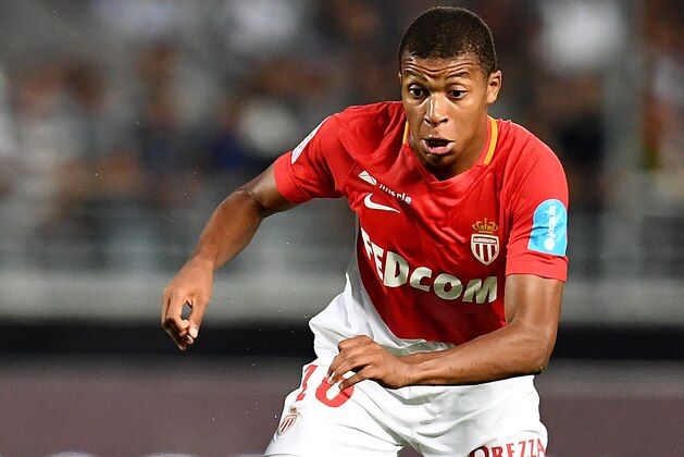 Monaco's French forward Kylian Mbappe runs with the ball  the ball  during the French Trophy of Champions (Trophee des Champions) football match between Monaco (ASM) and Paris Saint-Germain (PSG) on July 29, 2017, at the Grand Stade in Tangiers. / AFP PHOTO / FRANCK FIFE        (Photo credit should read FRANCK FIFE/AFP/Getty Images)