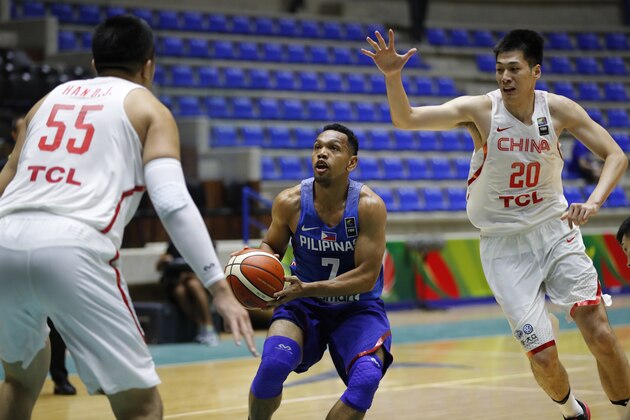 Philippines' Jayson castro William, center, challenges for the ball against China's Ren Junfei, right, and China's Han Dejun, left, during the FIBA Asia Cup 2017, at Nouhad Nawfal Sports Complex, in Zouk Mosbeh north of Beirut, Lebanon, Wednesday, Aug. 9, 2017. (AP Photo/Hussein Malla)