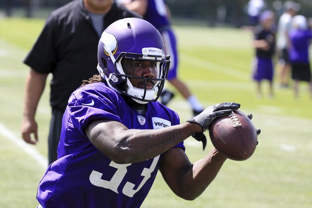 Minnesota Vikings running back Dalvin Cook (33) makes a catch during NFL football training camp Thursday, July 27, 2017, in Mankato, Minn. (AP Photo/Andy Clayton-King)