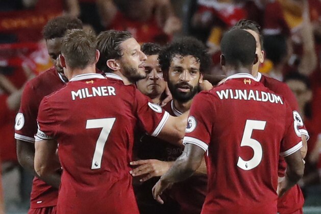 Liverpool's Mohamed Salah, center celebrates after scoring a goal during the final match against Leicester City FC at the Premier League Asia Trophy soccer tournament in Hong Kong, Saturday, July 22, 2017. (AP Photo/Kin Cheung)