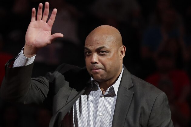 Former Phoenix Suns' Charles Barkley waves at the Phoenix Suns ring of honor induction ceremony of announcer Al McCoy at half time of an NBA basketball game against the Oklahoma City Thunder, Friday, March 3, 2017, in Phoenix. (AP Photo/Matt York)