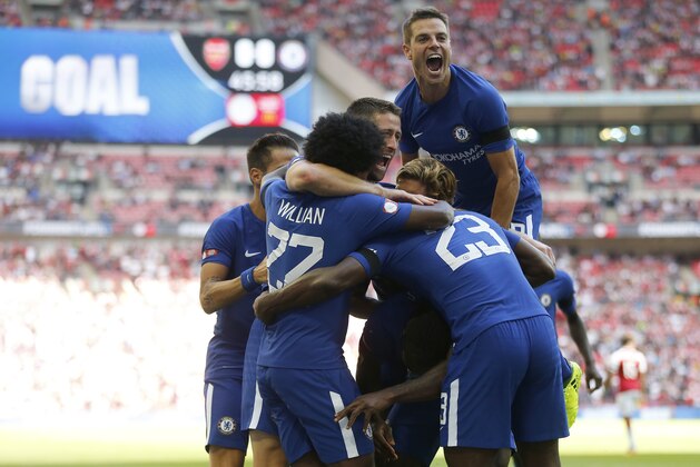 Chelsea's teammates celebrate after scoring their side's first goal during the English Community Shield soccer match between Arsenal and Chelsea at Wembley Stadium in London, Sunday, Aug. 6, 2017. (AP Photo/Frank Augstein)