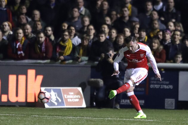 Arsenal's Lucas Perez kicks the ball to score a goal during their English FA Cup fifth round soccer match against Sutton United at Gander Green Lane stadium in London, Monday, Feb. 20, 2017. (AP Photo/Matt Dunham)