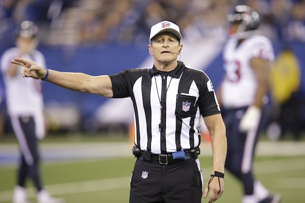 Referee Ed Hochuli (85) makes a call during the first half of an NFL football game between the Indianapolis Colts and the Houston Texans, Sunday, Dec. 20, 2015, in Indianapolis. (AP Photo/AJ Mast)