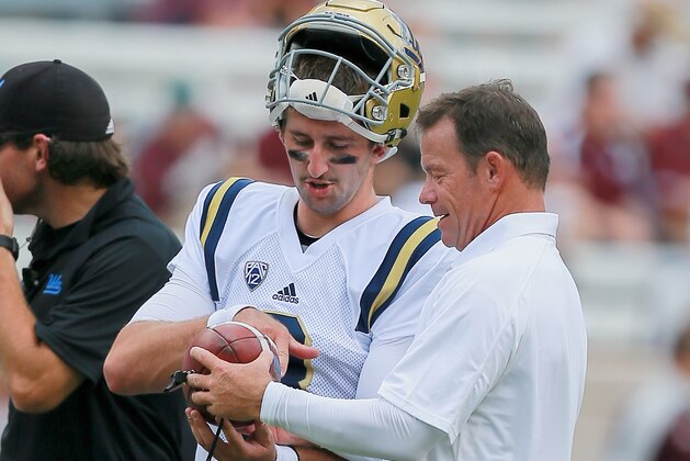 COLLEGE STATION, TX - SEPTEMBER 03: Josh Rosen #3 of the UCLA Bruins talks with head coach Jim Mora before playing the Texas A&M Aggies on September 3, 2016 in College Station, Texas. (Photo by Bob Levey/Getty Images)