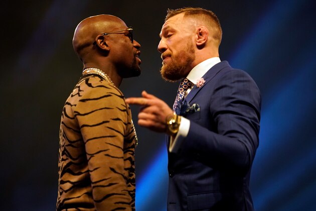 LONDON, ENGLAND - JULY 14:  (R-L) Conor McGregor and Floyd Mayweather Jr. face off during the Floyd Mayweather Jr. v Conor McGregor World Press Tour event at SSE Arena on July 14, 2017 in London, England. (Photo by Jeff Bottari/Zuffa LLC/Zuffa LLC via Getty Images)