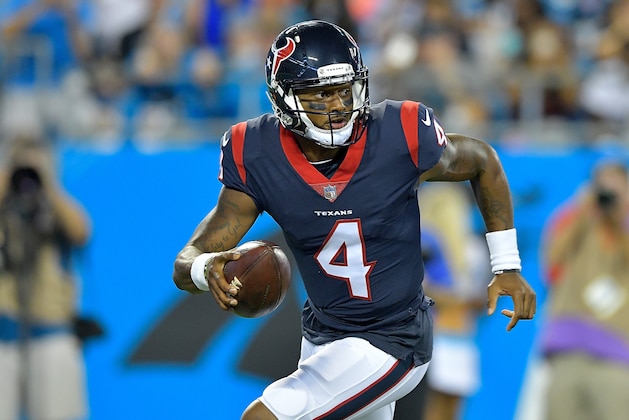 CHARLOTTE, NC - AUGUST 09:  Deshaun Watson #4 of the Houston Texans rolls out against the Carolina Panthers during the preseason game at Bank of America Stadium on August 9, 2017 in Charlotte, North Carolina.  (Photo by Grant Halverson/Getty Images)