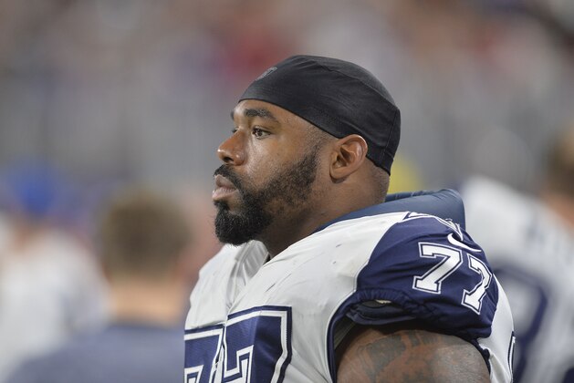 MINNEAPOLIS, MN - DECEMBER 1: Tyron Smith #77 of the Dallas Cowboys watches from the sidelines during an NFL game against the Minnesota Vikings at U.S. Bank Stadium December 1, 2016 in Minneapolis, Minnesota.  (Photo by Tom Dahlin/Getty Images)