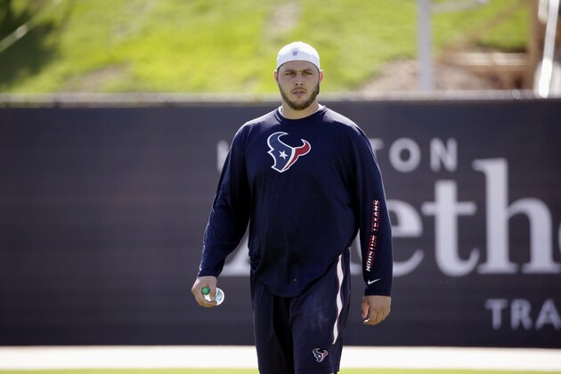 Houston Texans' David Quessenberry walks across the field during practice Monday, June 1, 2015, in Houston. (AP Photo/David J. Phillip)