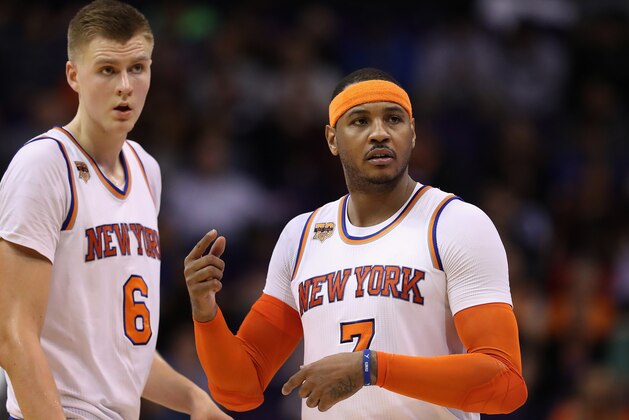 PHOENIX, AZ - DECEMBER 13:  Kristaps Porzingis #6 and Carmelo Anthony #7 of the New York Knicks reacts during the second half of the NBA game against the Phoenix Suns at Talking Stick Resort Arena on December 13, 2016 in Phoenix, Arizona.  The Suns defeated the Knicks 113-111 in overtime. NOTE TO USER: User expressly acknowledges and agrees that, by downloading and or using this photograph, User is consenting to the terms and conditions of the Getty Images License Agreement.  (Photo by Christian Petersen/Getty Images)