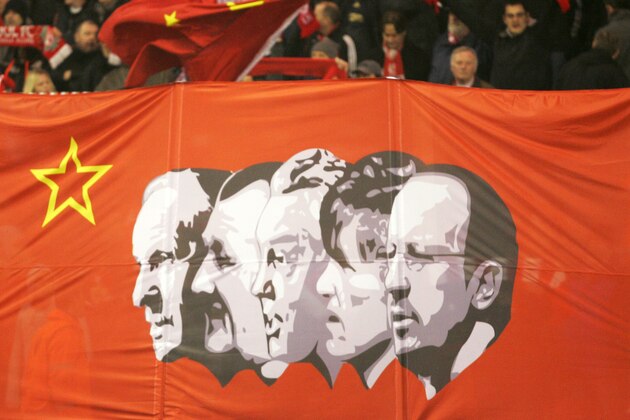 Liverpool fans hold up a banner   before their Europa League soccer match against Unirea Urziceni at Anfield, Liverpool, England, Thursday Feb. 18, 2010.  The banner shows from left former Liverpool managers Bill Shankly Bob Paisley, Joe Fagan, Kenny Dalglish and current  manager Rafa benitez(AP Photo/Tim Hales)