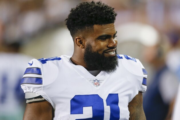 Dallas Cowboys running back Ezekiel Elliott (21) smiles on the sideling during the first half of the Pro Football Hall of Fame NFL preseason game against the Arizona Cardinals in Canton, Ohio, Thursday, Aug. 3, 2017. (AP Photo/Ron Schwane)