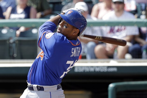 New York Mets' Dominic Smith bats against the Atlanta Braves in a spring training baseball game, Friday, March 10, 2017, in Kissimmee, Fla. (AP Photo/John Raoux)