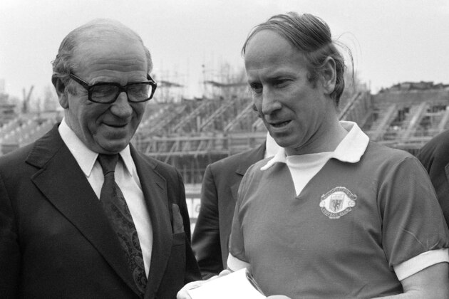 Veteran England and Manchester United soccer player Bobby Charlton, with his former Manchester United manager Sir Matt Busby, left, shows the silver cigarette box presented to him by the Chelsea Club before his 604 th and final League appearance against Chelsea FC at Stamford Bridge, London, United Kingdom on April 28, 1973. (AP Photo/Harris) Veteran England and Manchester United soccer player Bobby Charlton, with his former Manchester United manager Sir Matt Busby, left, shows the silver cigarette box presented to him by the Chelsea Club before his 604 th and final League appearance against Chelsea FC at Stamford Bridge, London, United Kingdom on April 28, 1973. (AP Photo/Harris)