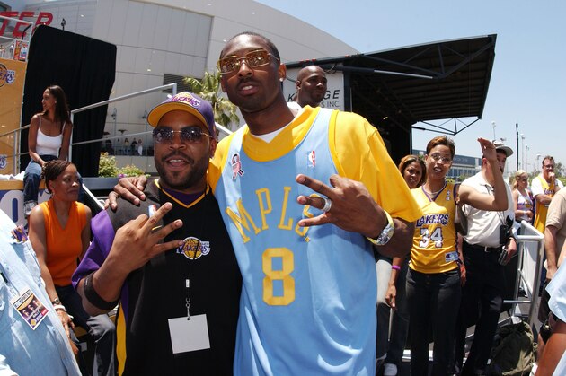 LOS ANGELES - JUNE 14: Kobe Bryant and Ice Cube at the Los Angeles Lakers parade outside of Staples Center on June 14, 2002 in Los Angeles, California. NOTE TO USER:  User expressly acknowledges and agrees that, by downloading and/or using this Photograph, User is consenting to the terms and conditions of the Getty Images License Agreement.  Mandatory copyright notice:2002 NBAE (Photo By Andrew D. Bernstein /NBAE/Getty Images)