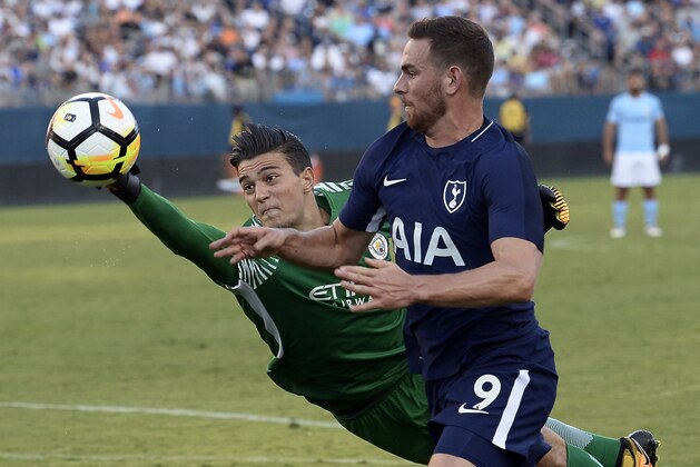 Manchester City goalkeeper Arijanet Muric, left, blocks a shot by Tottenham Hotspur forward Vincent Janssen (9) during the second half of an International Champions Cup match Saturday, July 29, 2017, in Nashville, Tenn. (AP Photo/Mark Zaleski)