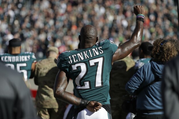 Philadelphia Eagles' Malcolm Jenkins raises his fist during the singing of the National Anthem before an NFL football game against the Atlanta Falcons, Sunday, Nov. 13, 2016, in Philadelphia. (AP Photo/Matt Slocum)