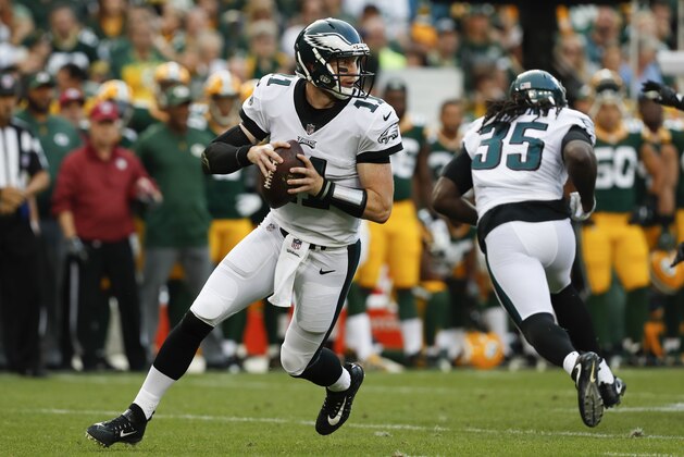 Philadelphia Eagles' Carson Wentz drops back during the first half of a preseason NFL football game against the Green Bay Packers Thursday, Aug. 10, 2017, in Green Bay, Wis. (AP Photo/Matt Ludtke)