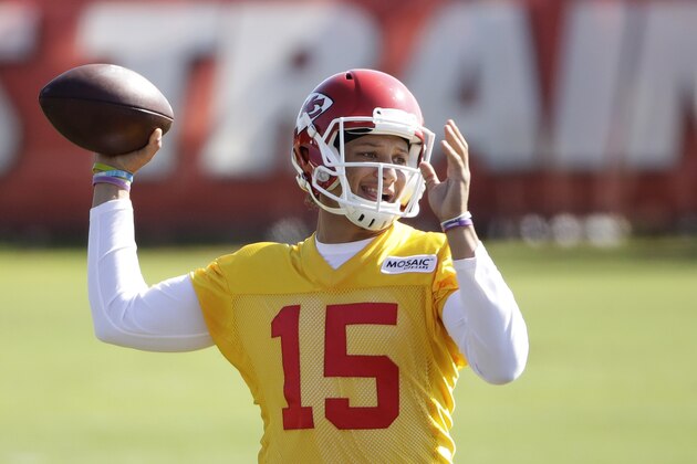 Kansas City Chiefs quarterback Patrick Mahomes (15) passes during NFL football training camp Saturday, July 29, 2017, in St. Joseph, Mo. (AP Photo/Charlie Riedel)