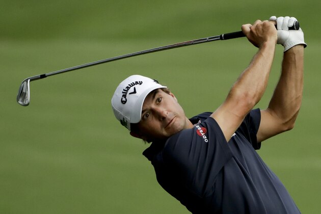 Kevin Kisner hits from the fairway on the 18th hole during the first round of the PGA Championship golf tournament at the Quail Hollow Club Thursday, Aug. 10, 2017, in Charlotte, N.C. (AP Photo/Chris O'Meara)