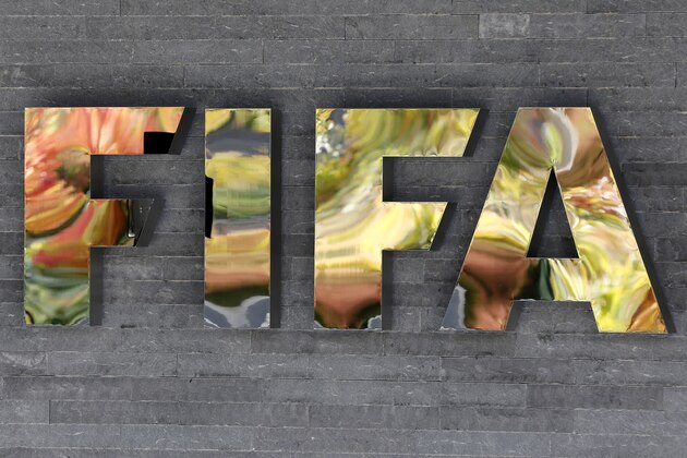 FILE - In this Sept. 25, 2015 file photo, the FIFA logo is fixed on a wall of the FIFA headquarters during a meeting of the FIFA Executive Committee in Zurich, Switzerland, Friday. FIFA canceled a news conference scheduled with President Sepp Blatter without explanation, fueling the sense of turmoil surrounding football’s embattled governing body. (AP Photo/Michael Probst, File)