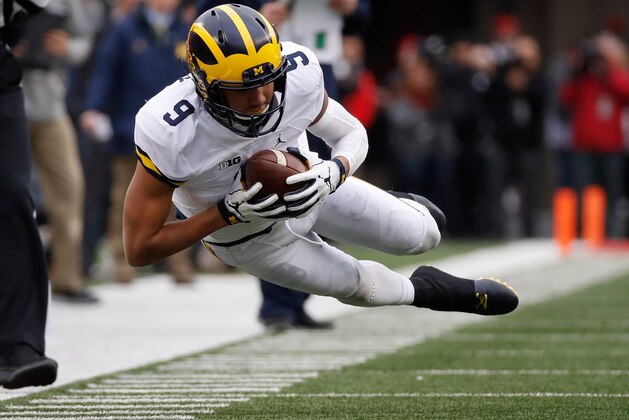 COLUMBUS, OH - NOVEMBER 26:   Grant Perry #9 of the Michigan Wolverines dives for a pass during the second quarter against the Ohio State Buckeyes at Ohio Stadium on November 26, 2016 in Columbus, Ohio.  (Photo by Gregory Shamus/Getty Images)