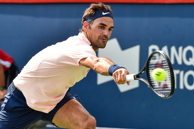 MONTREAL, QC - AUGUST 11:  Roger Federer of Switzerland hits a return against Roberto Bautista Agut of Spain during day eight of the Rogers Cup presented by National Bank at Uniprix Stadium on August 11, 2017 in Montreal, Quebec, Canada.  (Photo by Minas Panagiotakis/Getty Images)