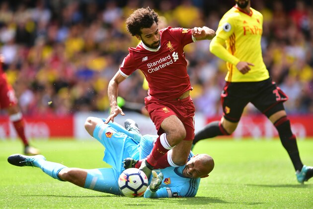WATFORD, ENGLAND - AUGUST 12: Mohamed Salah of Liverpool is fouled by Heurelho Gomes of Watford and a penalty is awarded to Liverpool during the Premier League match between Watford and Liverpool at Vicarage Road on August 12, 2017 in Watford, England. (Photo by Alex Broadway/Getty Images) WATFORD, ENGLAND - AUGUST 12: Mohamed Salah of Liverpool is fouled by Heurelho Gomes of Watford and a penalty is awarded to Liverpool during the Premier League match between Watford and Liverpool at Vicarage Road on August 12, 2017 in Watford, England. (Photo by Alex Broadway/Getty Images)