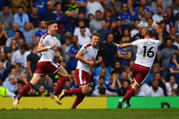 LONDON, ENGLAND - AUGUST 12:  Stephen Ward of Burnley celebrates scoring his sides second goal with Steven Defour of Burnley during the Premier League match between Chelsea and Burnley at Stamford Bridge on August 12, 2017 in London, England.  (Photo by Dan Mullan/Getty Images)